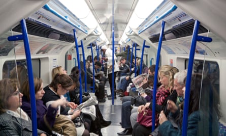 Passengers on a London tube train during evening rush hour.